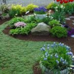 A garden with many flowers and plants in it