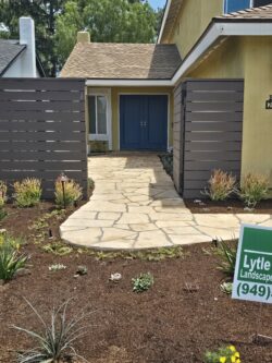 A yard with a sign that says lytle landscape.